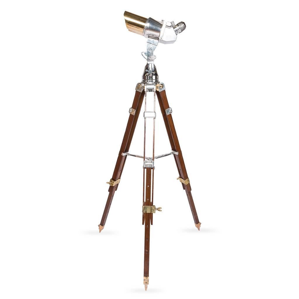 Genuine 20th century WWII German Joseph Schneider steel observation telescope binoculars on a later telescopic stand. This model was originally designed by Emil Busch and it has been adopted by the military in 1936. The model is suitable for both