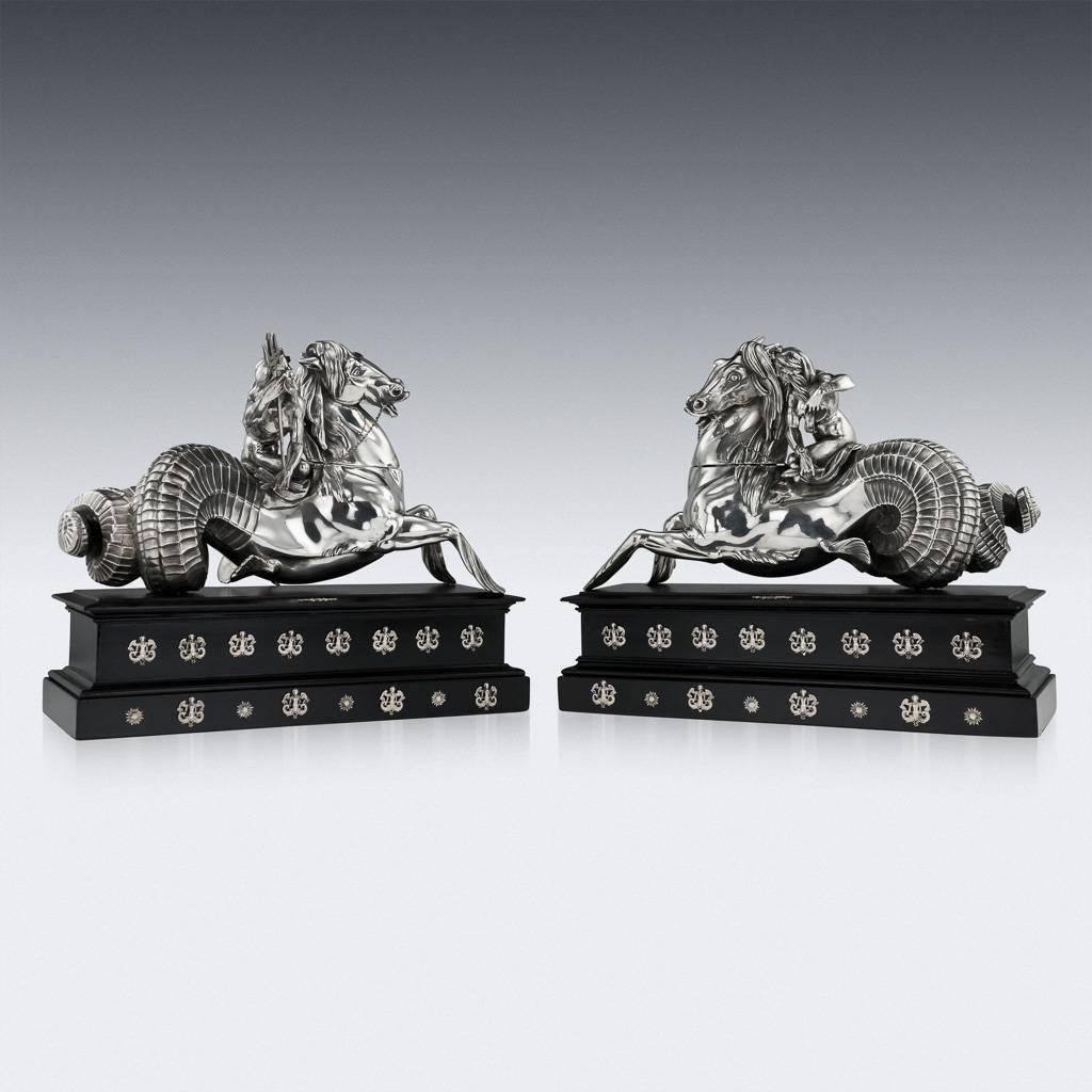 Antique early-19th century Italian solid silver pair of large and magnificent statues, beautifully modelled as Neptune and Amphitrite riding a pair of Hippocampus (mythical sea horses). Mounted on a rectangular ebonized base, decorated with delicate