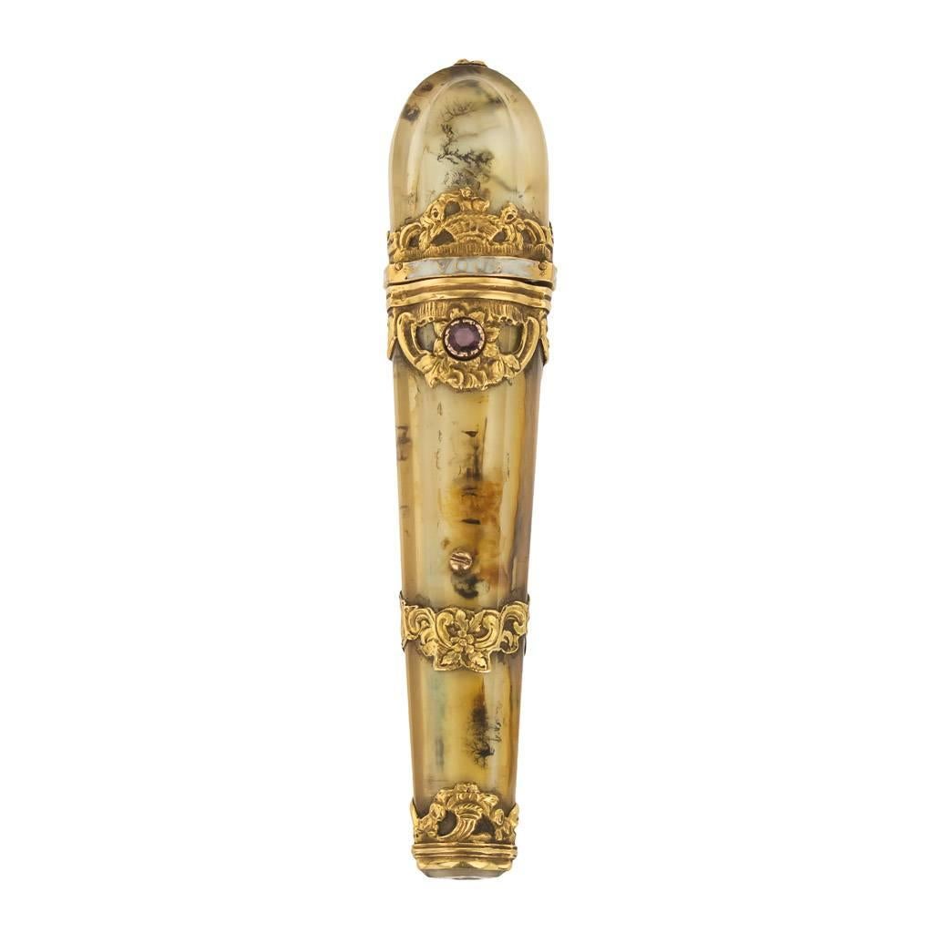 Antique mid-18th century French 18-karat gold-mounted on translucent moss agate sealing wax case, of cylindrical form, the openwork gold mounts chased with scrolls and flowers, mounted with an old cut ruby push button and enamel band along the lid