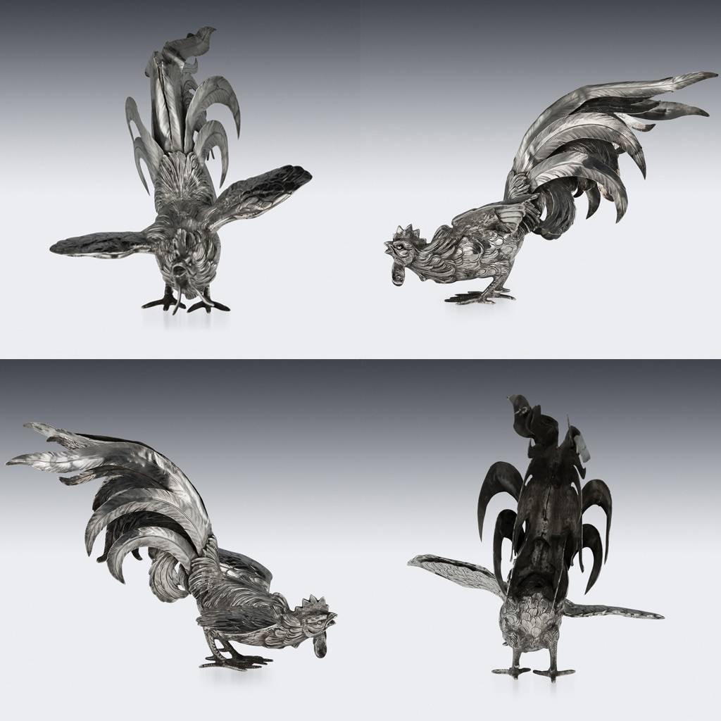 Antique 20th century German solid silver pair of table ornaments representing fighting cockerels, both extremely detailed and ornamental, very naturalistically and well-refined to the last detail. Both hallmarked 830 (830 Standard), probably German,