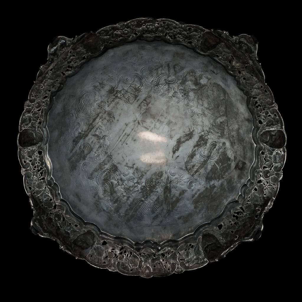 Description
Antique 19th century Victorian rare and exceptional solid silver salver with cast Bacchanalia border, impressively large size and extremely heavy gauge, of shaped-circular form on three impressive cast feet, with applied cast border