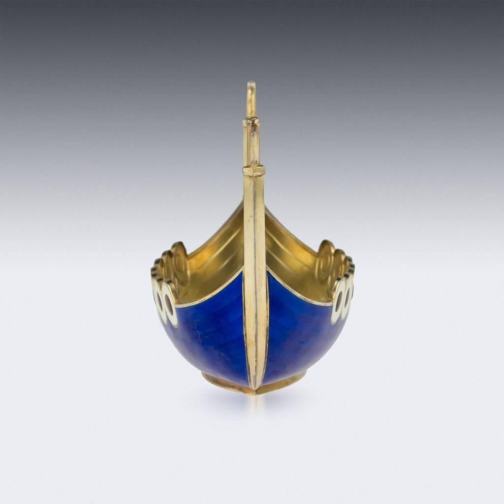 DESCRIPTION
Antique 20th Century Norwegian solid silver-gilt & enamel 'Dragestil' Viking longboat, the sides applied with translucent blue, red and white guilloche enamel. Hallmarked Sterling (925 silver standard), Norway, Oslo, Maker Jacob Tostrup