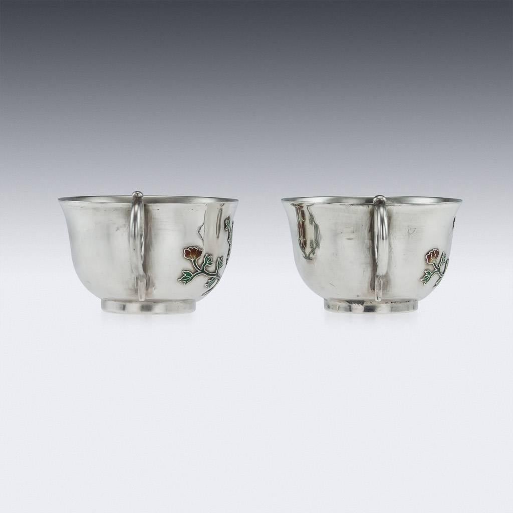 Antique 19th century extremely rare Chinese solid silver and enamel pair of tea cups and saucers, the sides are applied with cloisonné enamel, depicting chrysanthemum flowers. The tea cups are of good traditional size and features stunning