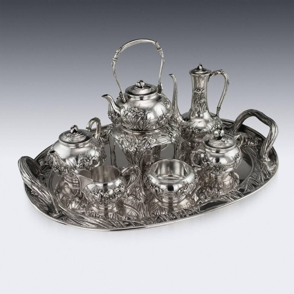 Description
Antique early-20th century Japanese solid silver massive six-piece tea & coffee service on tray, exceptional and magnificent quality, double walled, embossed and applied with Iris flowers in high relief, with C-form handles and lids