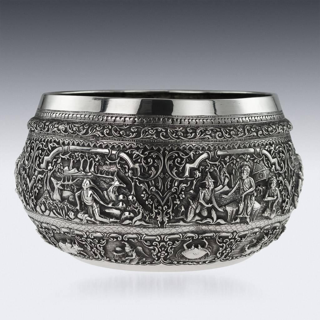 Antique late-19th century exceptional Burmese, Myanmar solid silver Thabeik bowl, repousse' decorated in high relief depicting different traditional scenes from the Burmese mythology, showing very detailed figures set against a chiselled matted