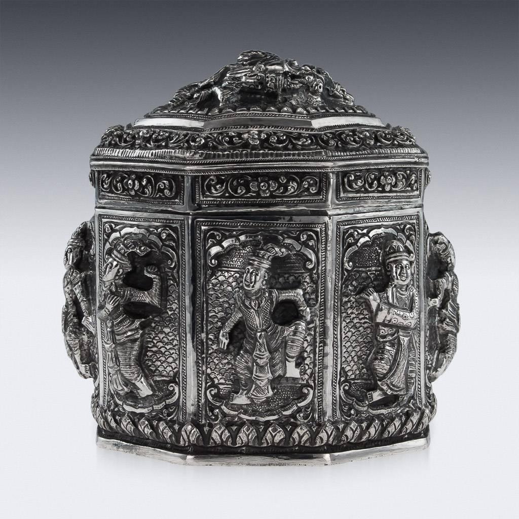 Antique 20th century Burmese solid silver box, of octagonal form, the sides and the cover are embossed and chased with figures in very high-relief, surrounded by typical scrolling foliage.

The stunning quality piece features a particularly heavy