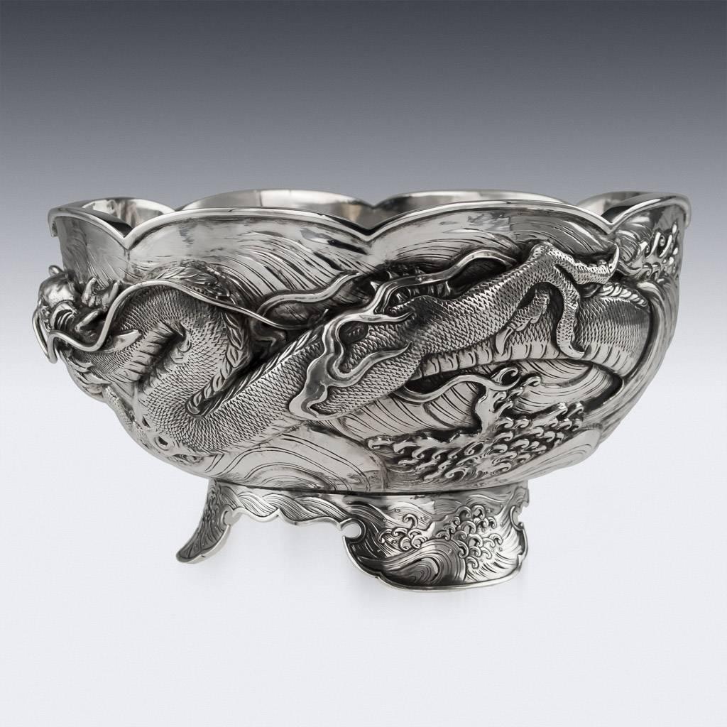 Antique 19th century Japanese Meiji period solid silver water dragon bowl, exceptional and magnificent quality, double walled, chased, embossed and applied with a water dragon in very high relief with applied flowing whiskers. The base is signed in