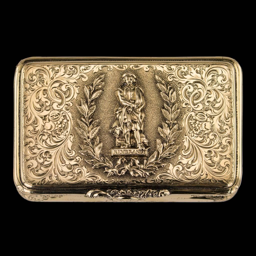 Antique 19th century German 14-karat solid gold snuff box, of rectangular cushion shape, the lid applied with a statue of Rembrandt on matted ground surrounded with laurel leaves, hinged lid applied with a floral thumb-piece, throughout engraved