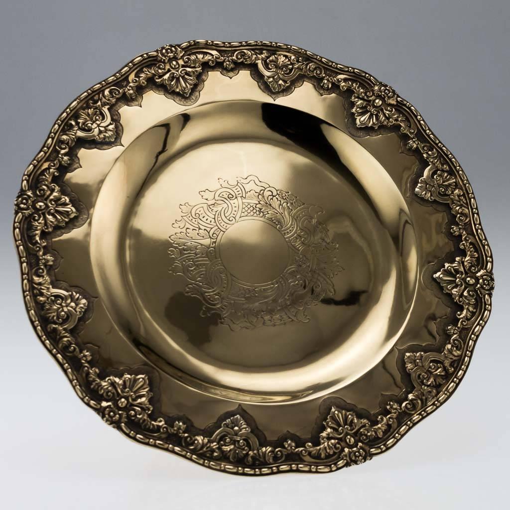 Antique 19th century rare pair of Georgian solid silver tazzas, exceptionally heavy and richly gilt, of circular form with applied scroll and flower borders, each centre chased with a Rococo scroll and leaf decoration. Both are Hallmarked English