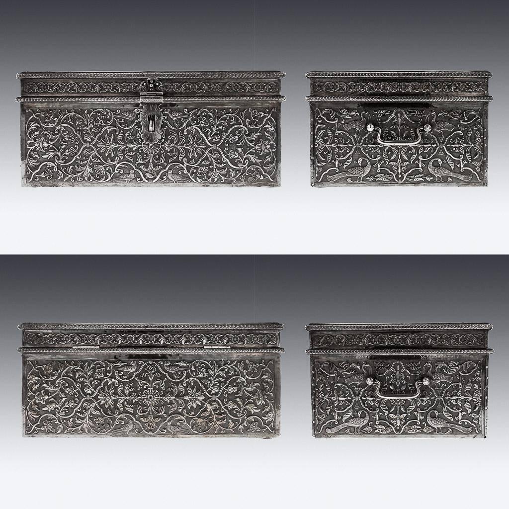 Antique 19th Century rare Indian Solid Silver treasure chest / casket, massive size, of rectangular form with hinged lid, foliate lock and hinged handles, profusely repousse' decorated with scrolling foliage on a matted ground, the lid featuring a