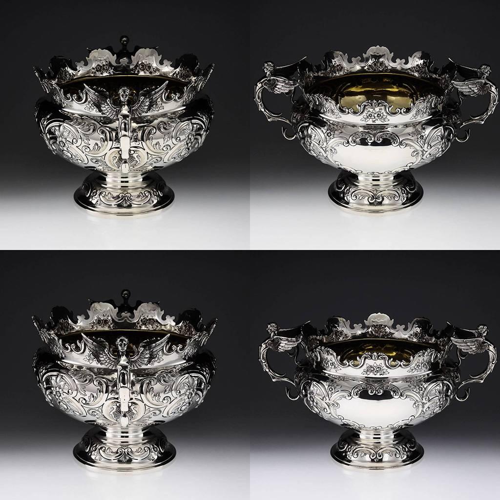 Antique early 20th Century Edwardian Solid Silver very large Monteith Bowl / Wine bottle Cistern / Centerpiece, of circular form, twin cast figural handles modelled like winged female caryatids, the body is profusely embossed with a lovely scroll