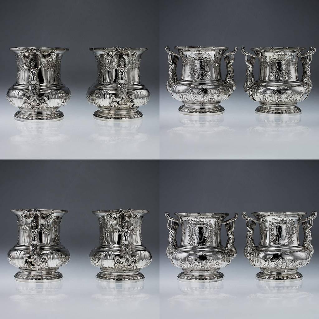 Antique 19th Century pair of exceptional German Hanau Solid Silver wine / champaigne coolers, each exceptionally decorative and ornamental, with figural cast handles modelled as a mermaid with bifurcated tails holding sea snakes, the body embossed