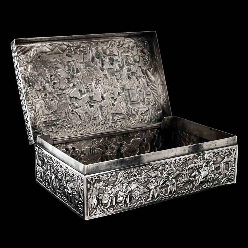 Antique 19th Century rare Chinese Export Solid Silver large box, of rectangular form, decorated in repousse' relief with various figures in a landscape, including fighting warriors, dignitaries, attendants amongst palaces and pavillions and a