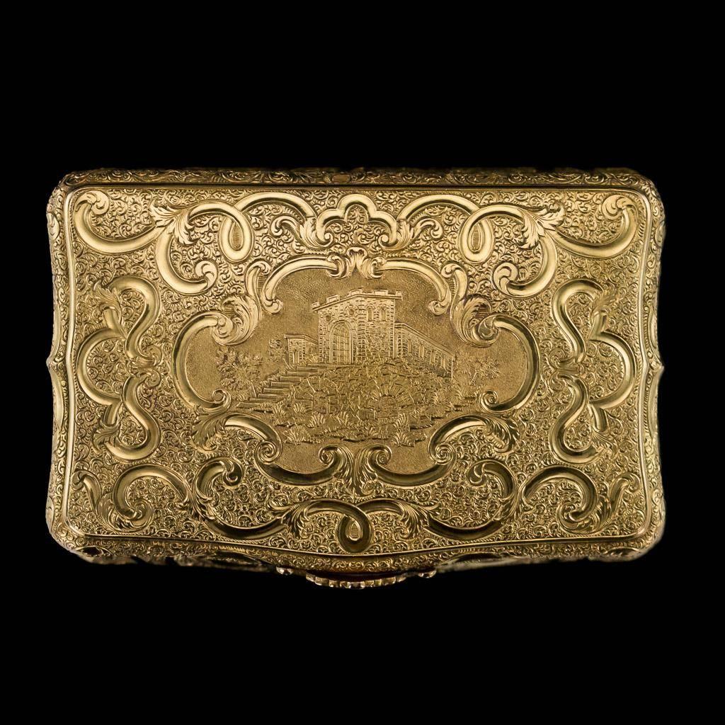 Antique 19th century German magnificent 14-karat solid gold snuff box, of rectangular cushion shape, the lid engraved with a castle on textured and scrolled ground, applied with a floral thumbpiece, corners and sides engraved with floral bouquets.