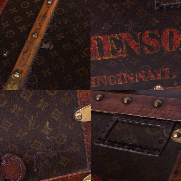 A LOUIS VUITTON WARDROBE TRUNK MODIFIED AS A COCKTAIL BAR AND