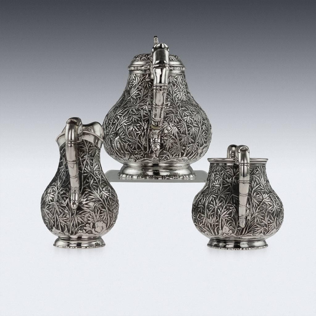 Antique mid-19th century Chinese Export solid silver three piece tea set, comprising of a teapot, sugar bowl, milk jug, each pear shaped body is beautifully chased with bamboo leaves on a matted surface, each piece rests on a decorative domed foot