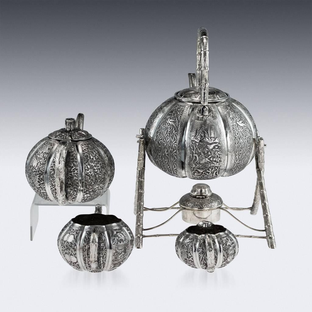 Antique late 19th century Chinese Export solid silver four-piece tea service, comprising of a kettle on stand, teapot, sugar bowl, milk jug, each melon shaped body is beautifully chased with bamboo leaves, flowers and people in landscapes on a