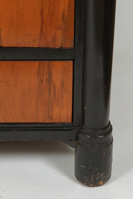 19th century Biedermeier chest of drawers.
Ebony finish on frame with fruitwood drawers.
