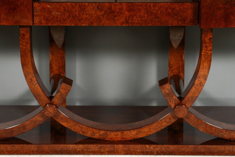 Art Deco style sideboard by German fine furniture maker Cygal Art Deco made of burl walnut with four grey shagreen center drawers and brass hardware. Interior is made of burl and ebonized walnut.
This model is also available in custom finishes and