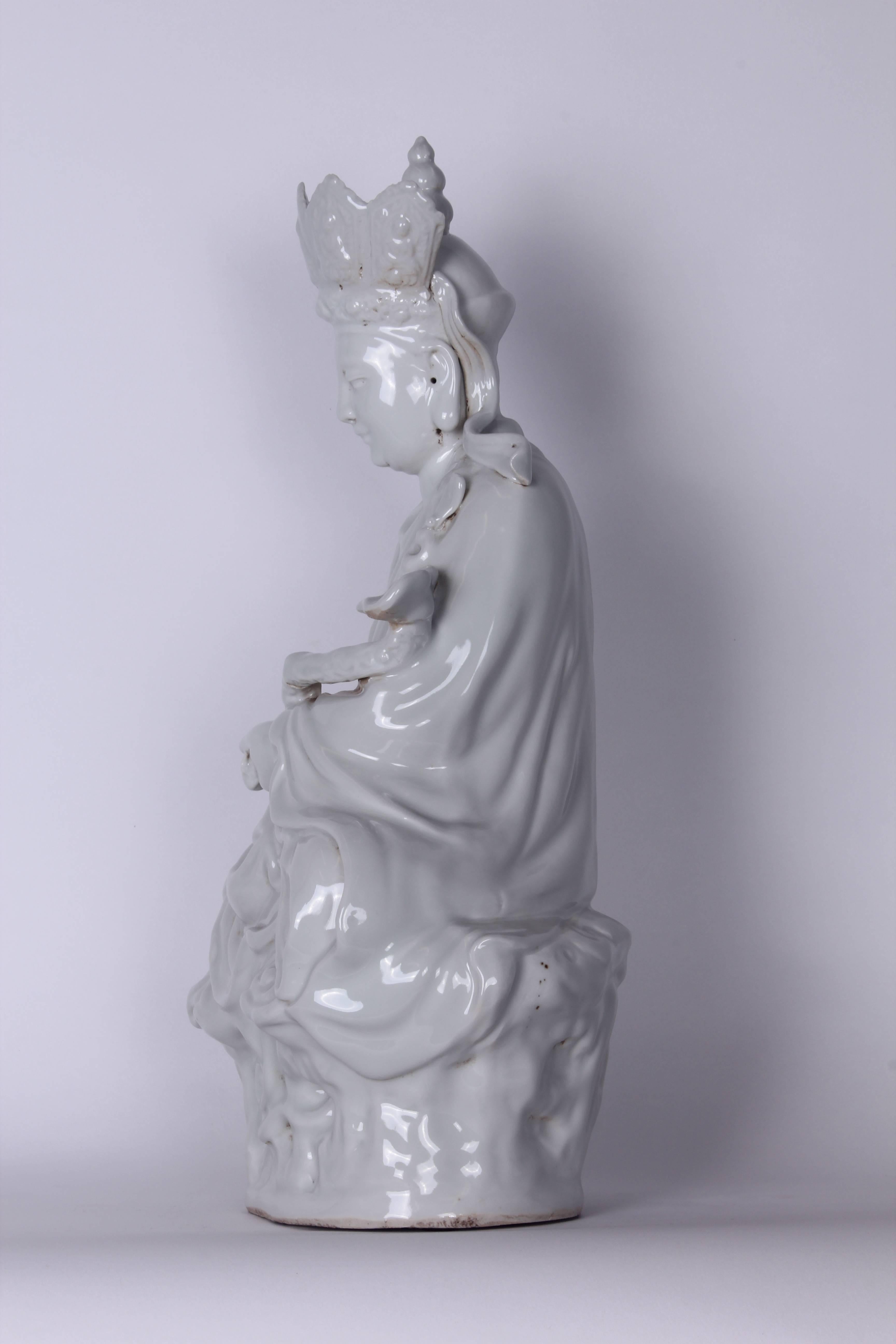 Vintage Blanc de Chine Bodhisattva statue with seal at base.