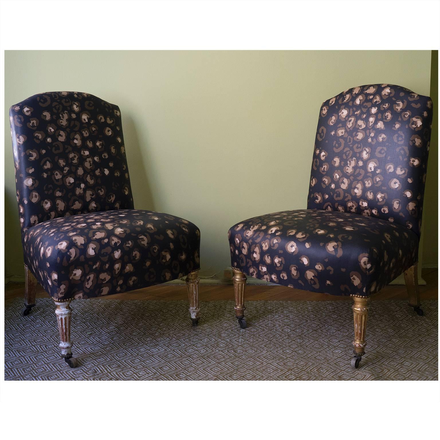 Pair of late 19th century French slipper chairs with gilded legs, circa 1890. Newly upholstered in Bob Collins glazed chintz.