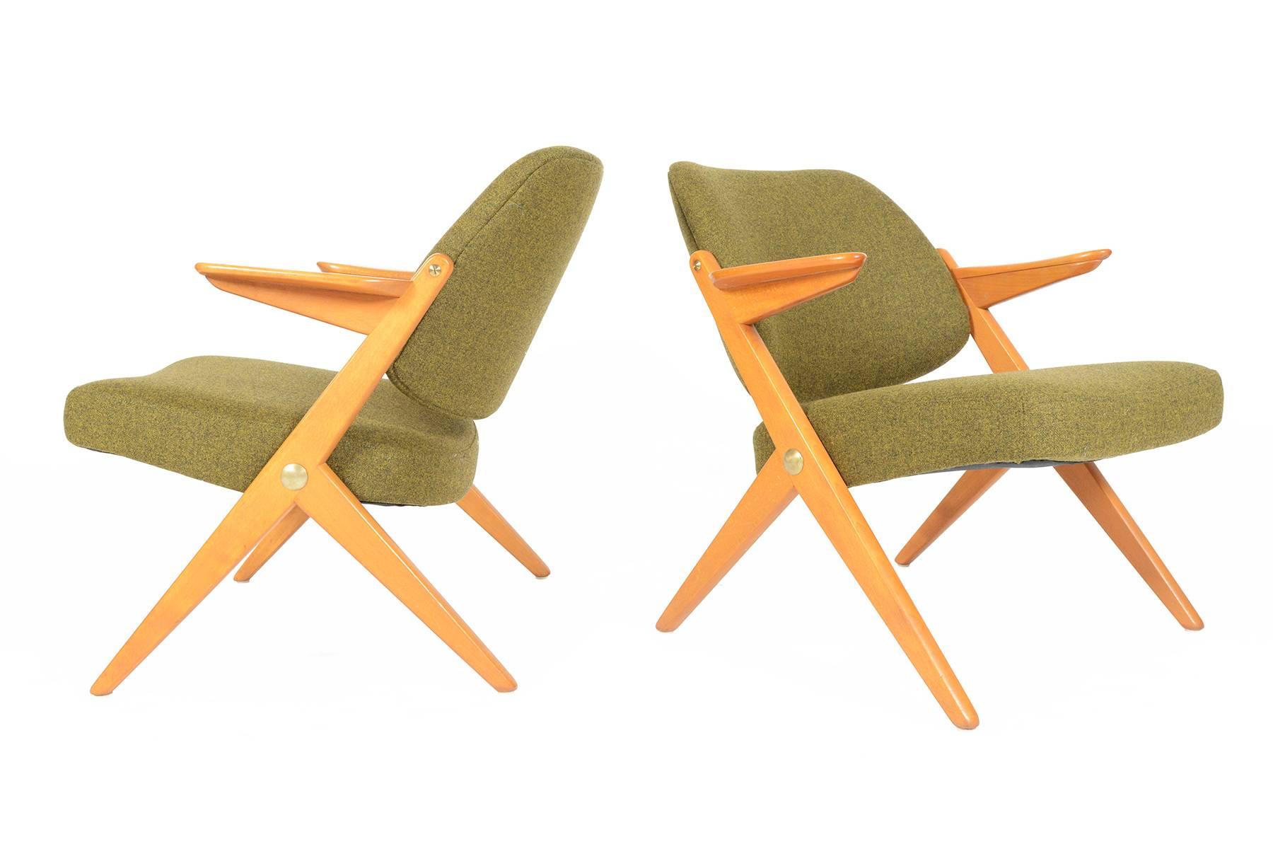 This pair of Danish modern Bengt Ruda designed lounge chairs is a true modern Classic. Crafted in birch and manufactured by Nordiska for the 