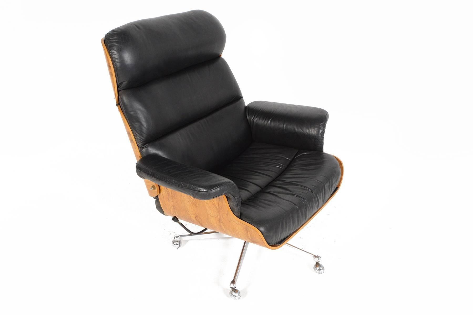 Designed by Martin Stoll for Giroflex of Switzerland, this gorgeous recliner offers the Classic Silhouette of an Eames chair but with a Scandinavian twist! Large panels of bent ply are veneered in stunning sun kissed Brazilian rosewood. Patinated