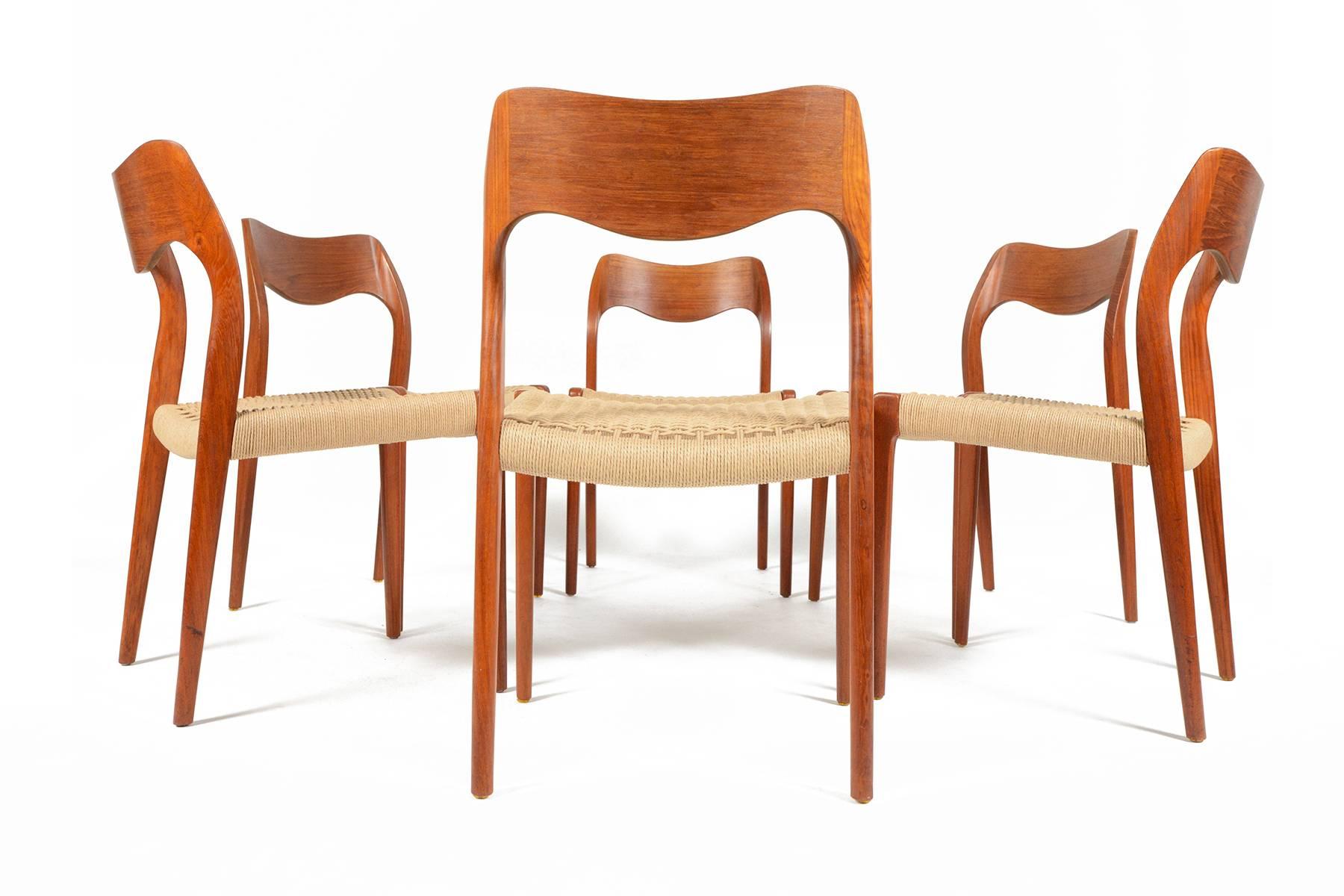 This set of six Møller model 71 dining chairs in teak are a rare find. Designed in the 1960s by Niels Otto Møller for J. L. Møller, this set is crafted in solid teak. Seats have recently been recorded in paper cord. Frames are in excellent original