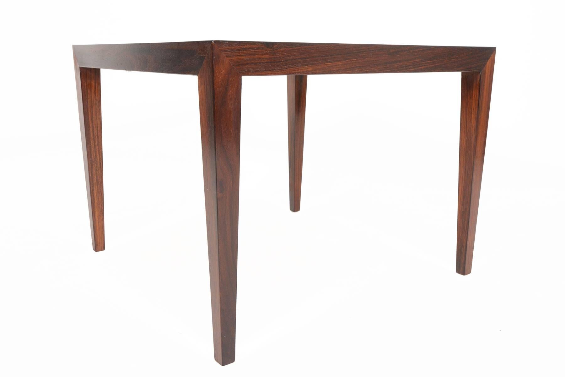 This Danish modern Mid-Century coffee table in rosewood was designed by Severin Hansen for Haslev Mobelsnedkeri in the 1960s. This simple piece features excellent joinery and craftsmanship. In excellent original condition with typical wear for their