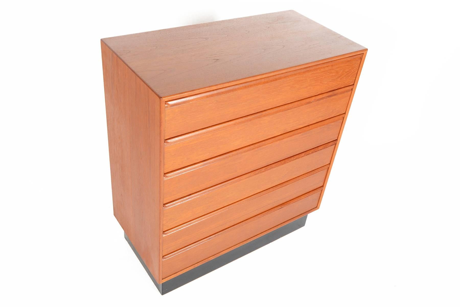 This handsome Norwegian modern teak dresser by Westnofa offers ample storage with its six deep drawers and wide construction. Crafted from solid wood, drawers are cased in mahogany to mark its superior quality. Carved drawer pulls above each drawer