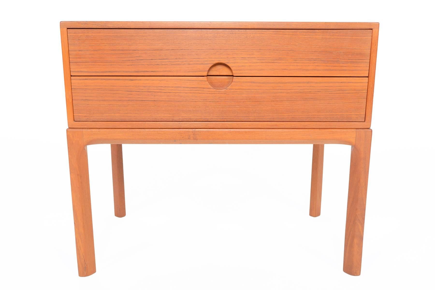 This beautiful model 384 Danish modern Mid-Century entry chest will add style and elegance to any modern home. Designed by Aksel Kjersgaard for Odder Mobler and crafted in teak and birch. Excellent for use as a nightstand or entryway chest, this