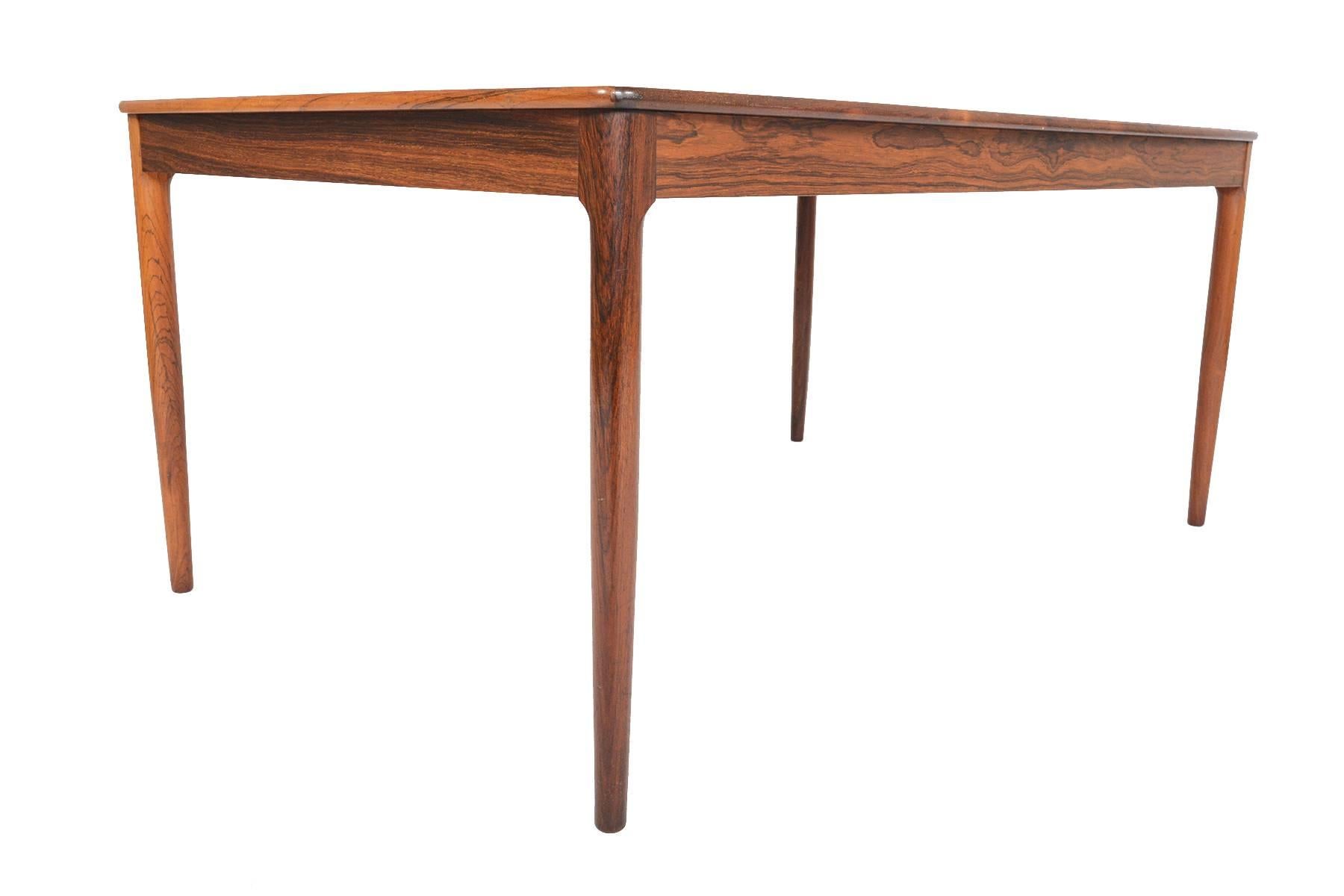 This magnificently large Yngvar Sandström designed Brazilian rosewood coffee table will add beauty to any home. Produced by AB Seffle Möbelfabrik in the 1960s, this gorgeous piece features brilliantly deep woodgrain, and soft rounded edges raised