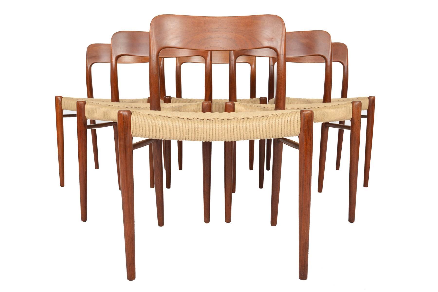 This set of six Møller model 75 dining chairs in teak are a rare find. Designed in the 1960s by Niels Otto Møller for J.L. Møller, this set is crafted in solid teak. Seats have been recorded in paper cord. Frames are in original condition.
 