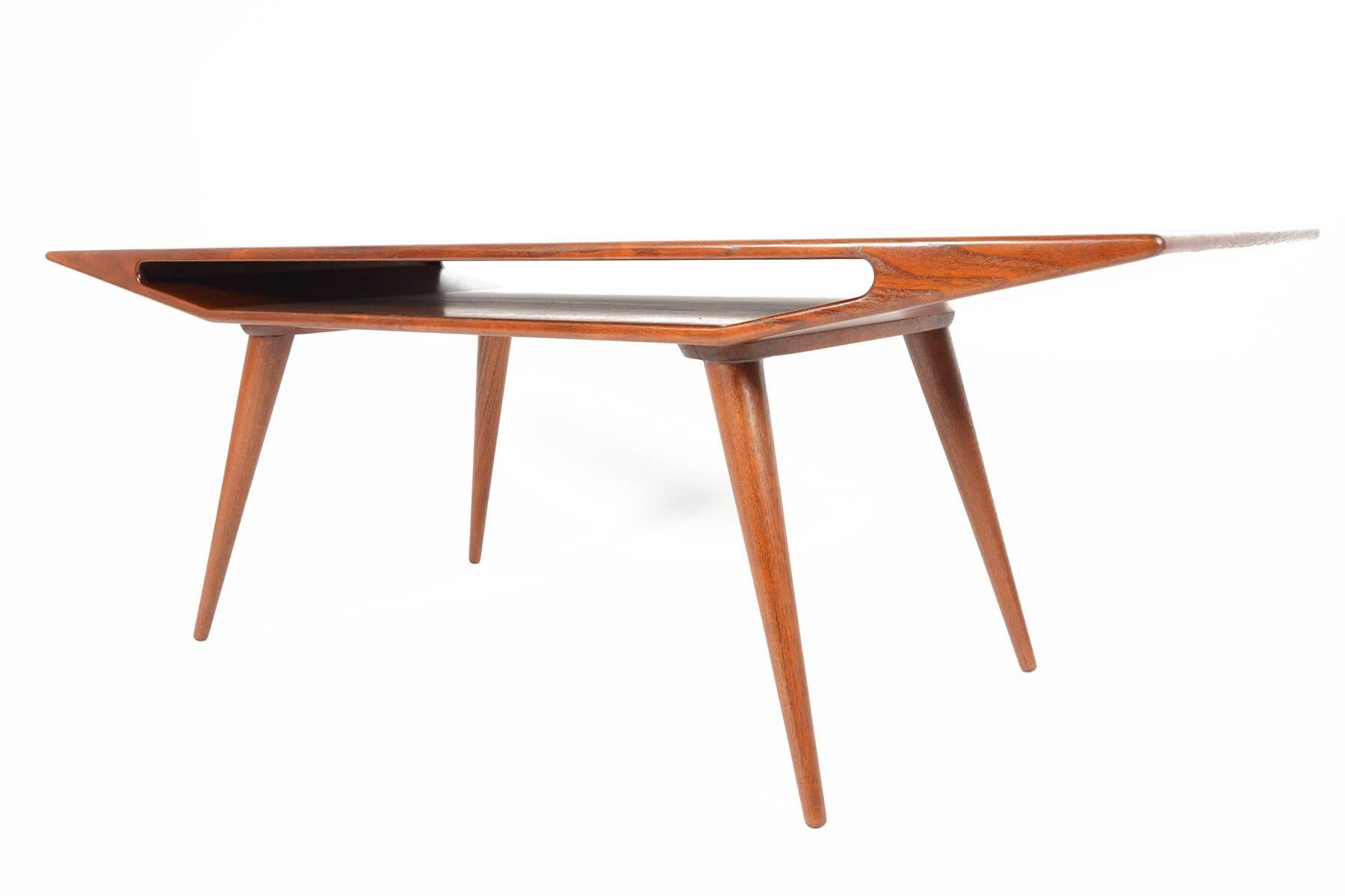 This rare teak coffee table was designed by Gunni Omann for Omann Jun as 
