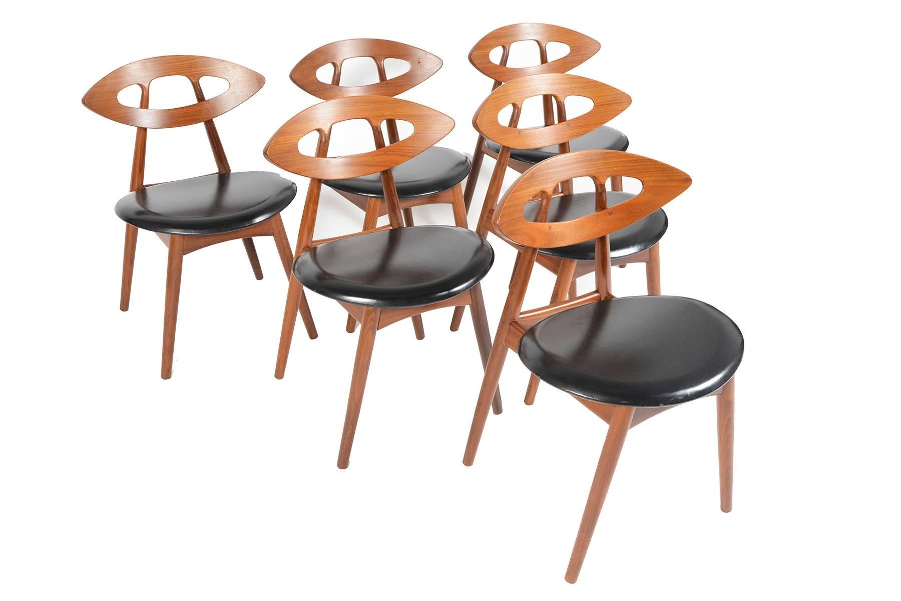 This magnificent set of six Danish modern dining chairs was designed by Ejvind A. Johansson for Ivan Gern Møbelfabrik in 1961. This Model 84 is more commonly known as the 