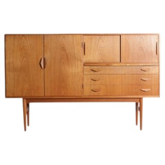 1960s Danish High Sideboard in Teak With Mirror Backed Bar