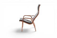 Yngve Ekstrom Lamino Armchair in Teak + Black Leather by Swedese