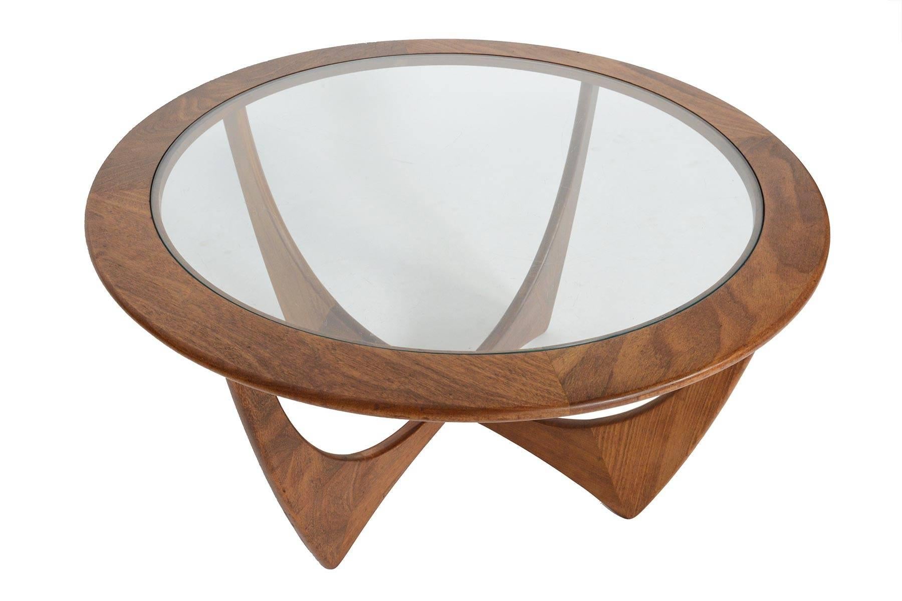 This iconic Mid-Century Modern round afromosia and glass coffee table was designed by Victor Wilkins for G Plan's 