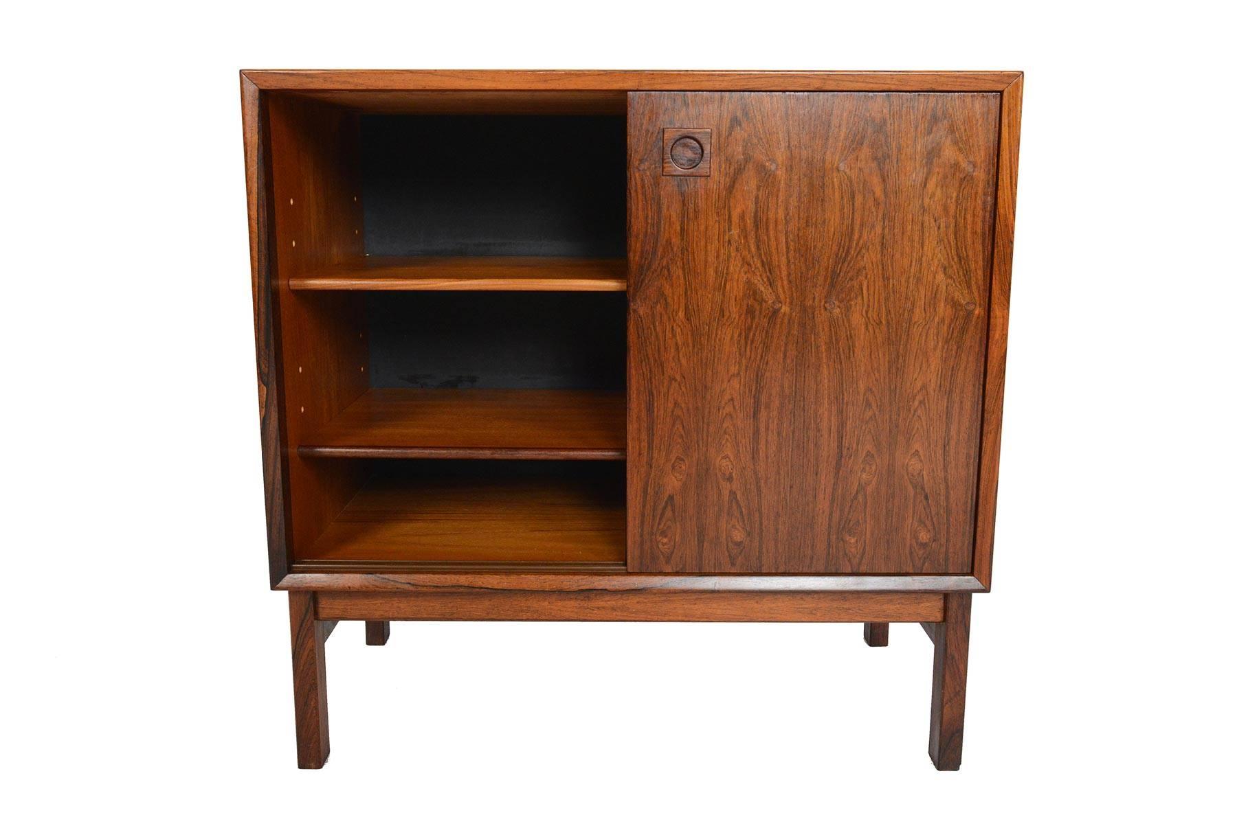 This beautiful Danish modern mid century credenza is perfect for any smaller space in your home. Crafted in gorgeous Brazilian rosewood, two sliding doors open to two adjustable shelves. In excellent original condition.

 