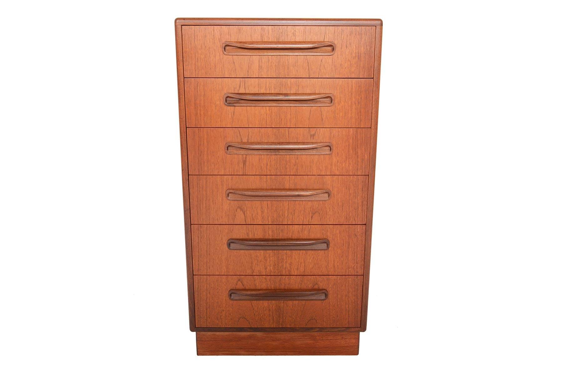 This English modern G Plan Fresco lingerie chest was designed by Victor Wilkins in the 1960s. This fantastic dresser features six deep drawers with solid teak drawer fronts and carved afrormosia pulls. With its slender design, this piece is perfect