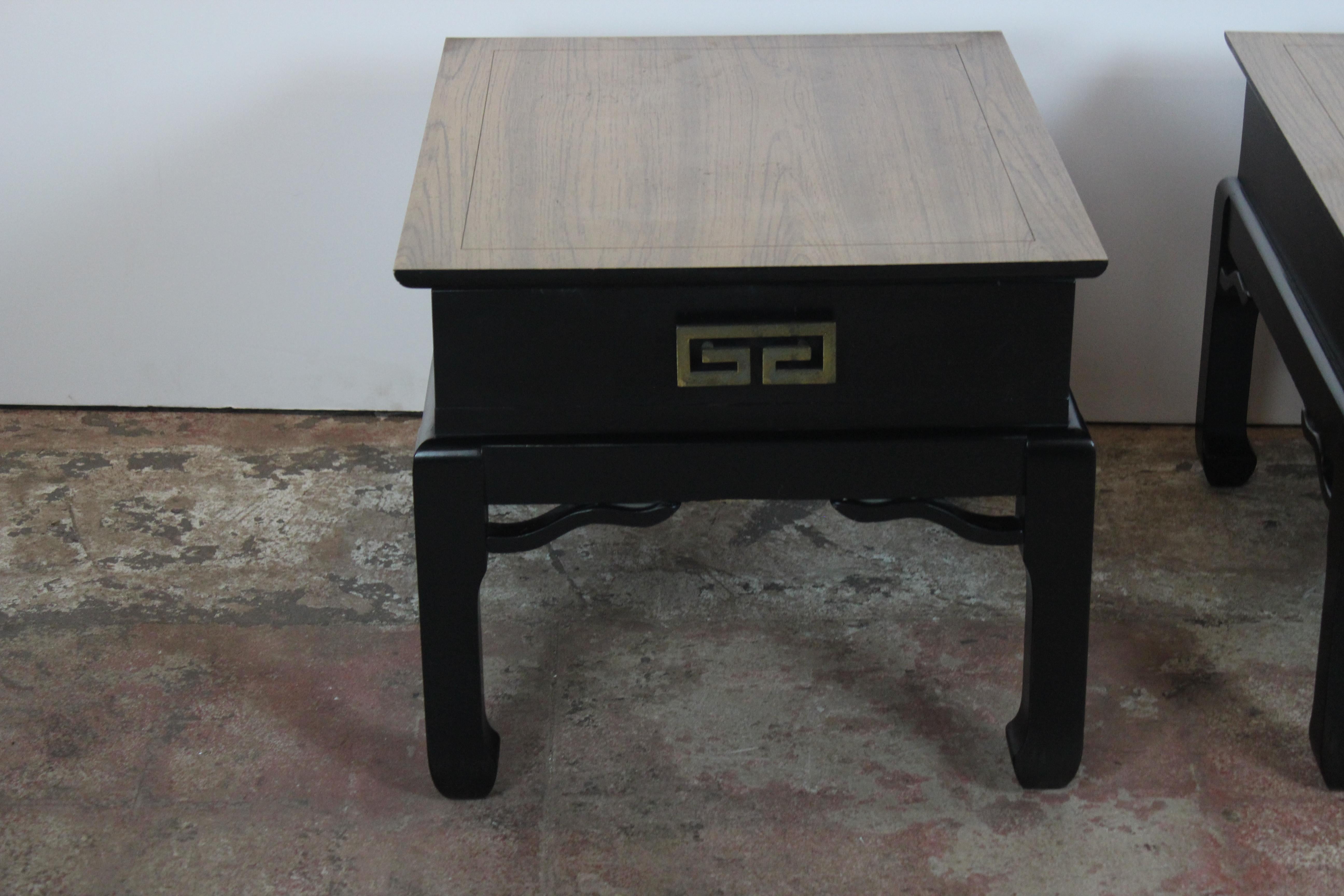Pair of Asian style end tables with single drawer brass handles.