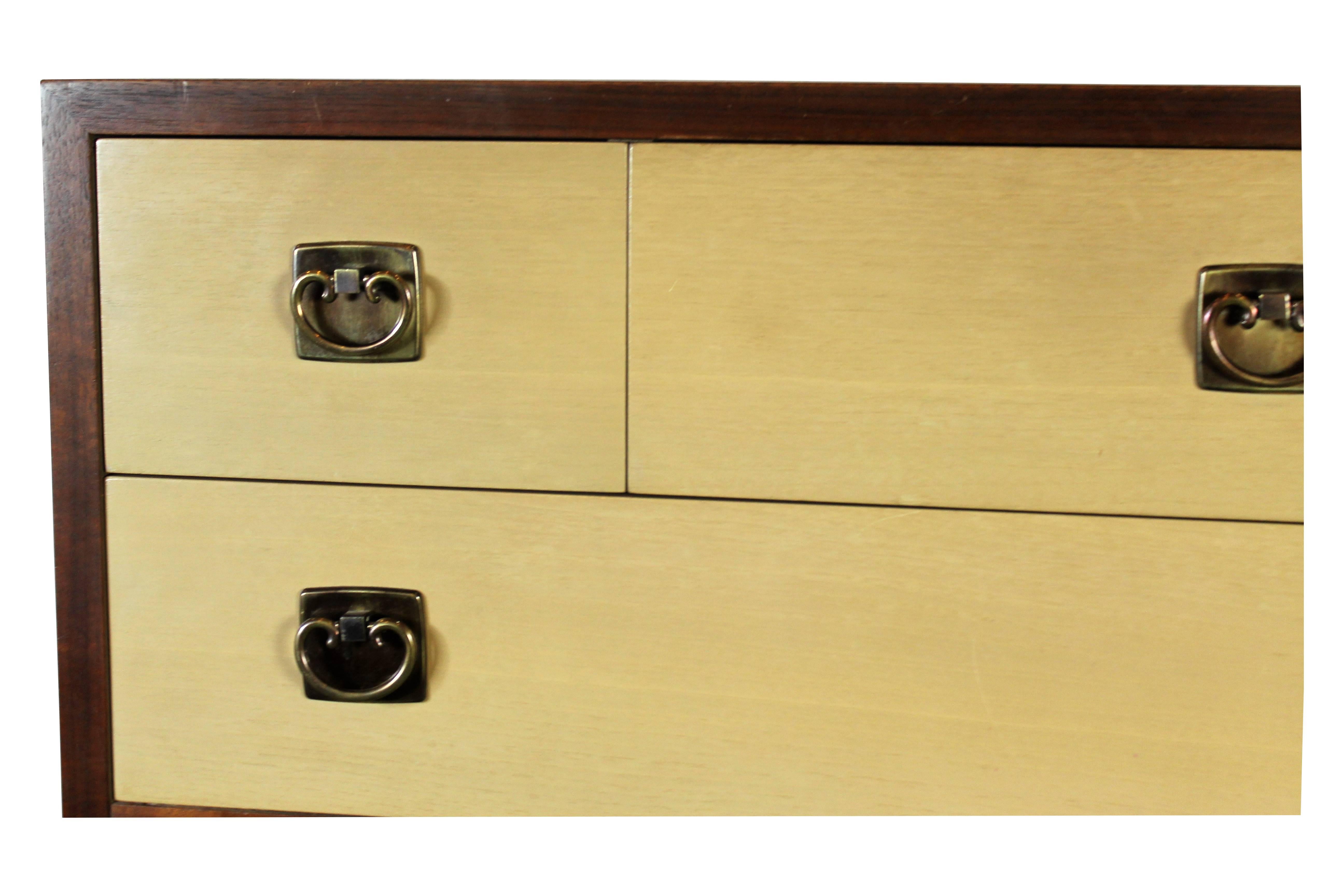 Midcentury high chest by Paul Frankl for Jonson Furniture. Extremely well made the construction is dove tail, original hardware, legs are brass sabots. The top drawers are smaller and you have larger drawers at the bottom.