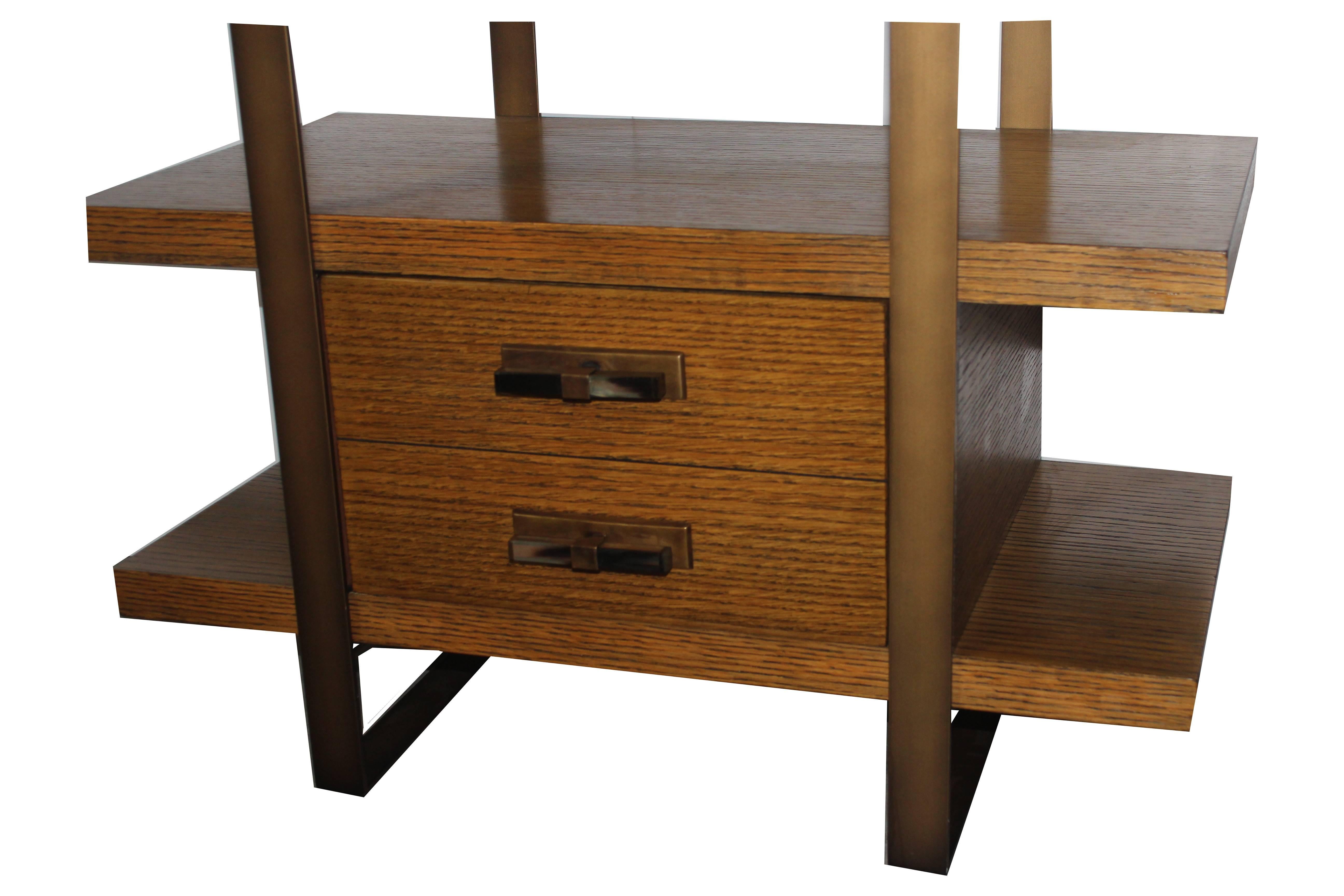 Etagere made by Baker. It has seven shelves a single drawer bottom shelve with metal accent.
