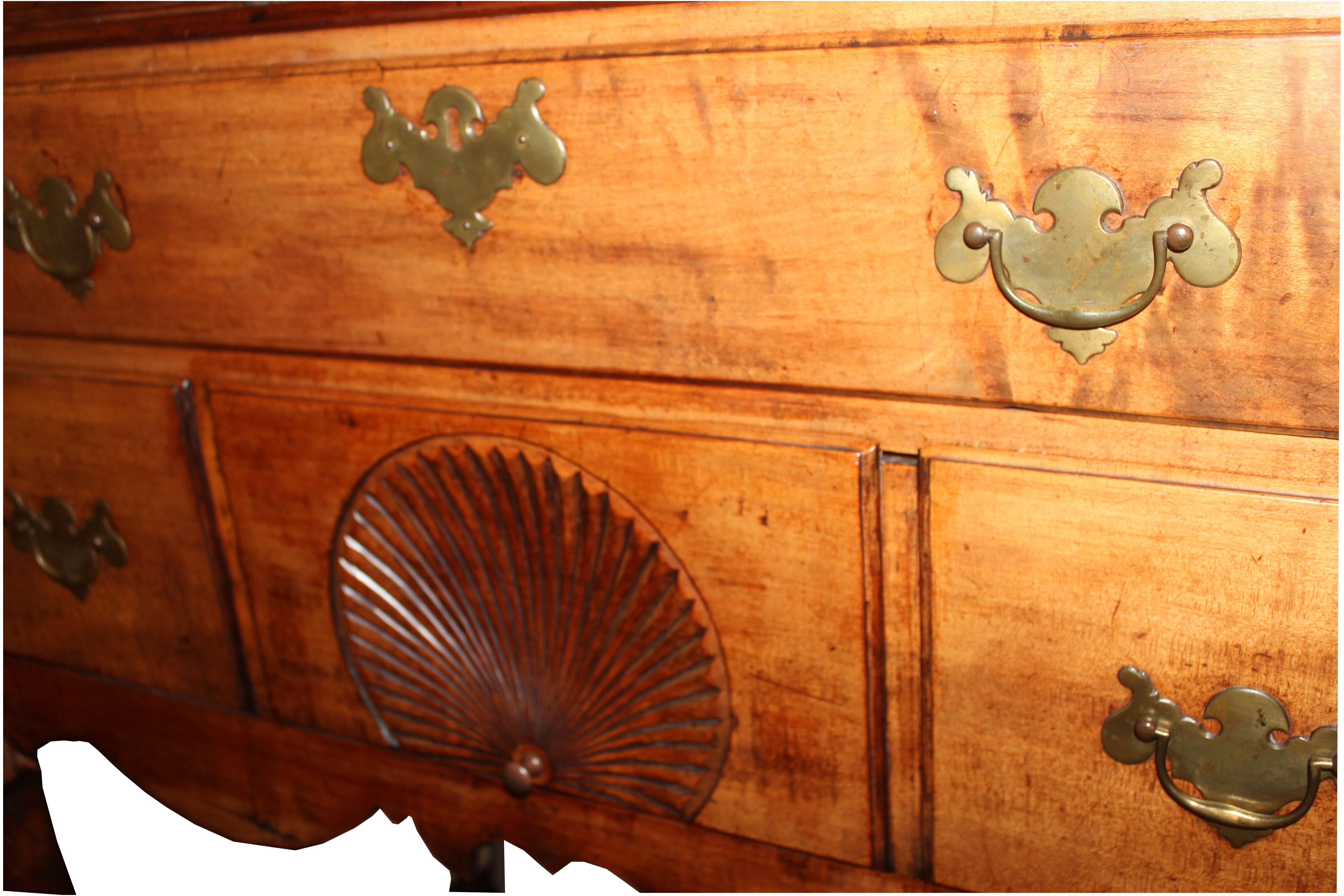 Handsome 1780 New Hampshire maple chest. Two part with queen legs. The hardware not original and small carving missing.