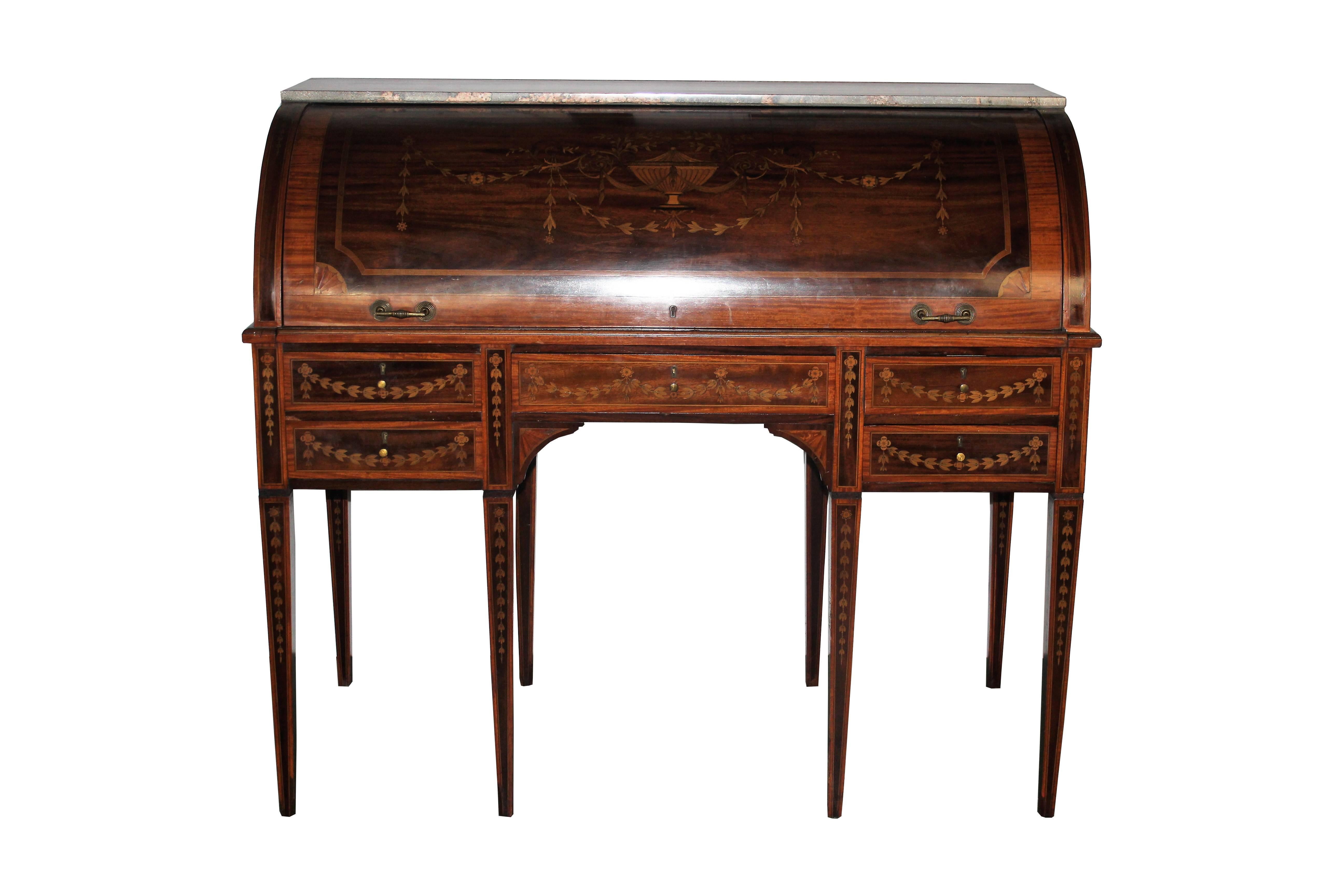 Wonderful quality English cylinder desk. Mahogany and satinwood inlaid with flower swags and urn all around. The interior is cross banded has pull-out writing surface with tooled leather. The marble has been placed latter.