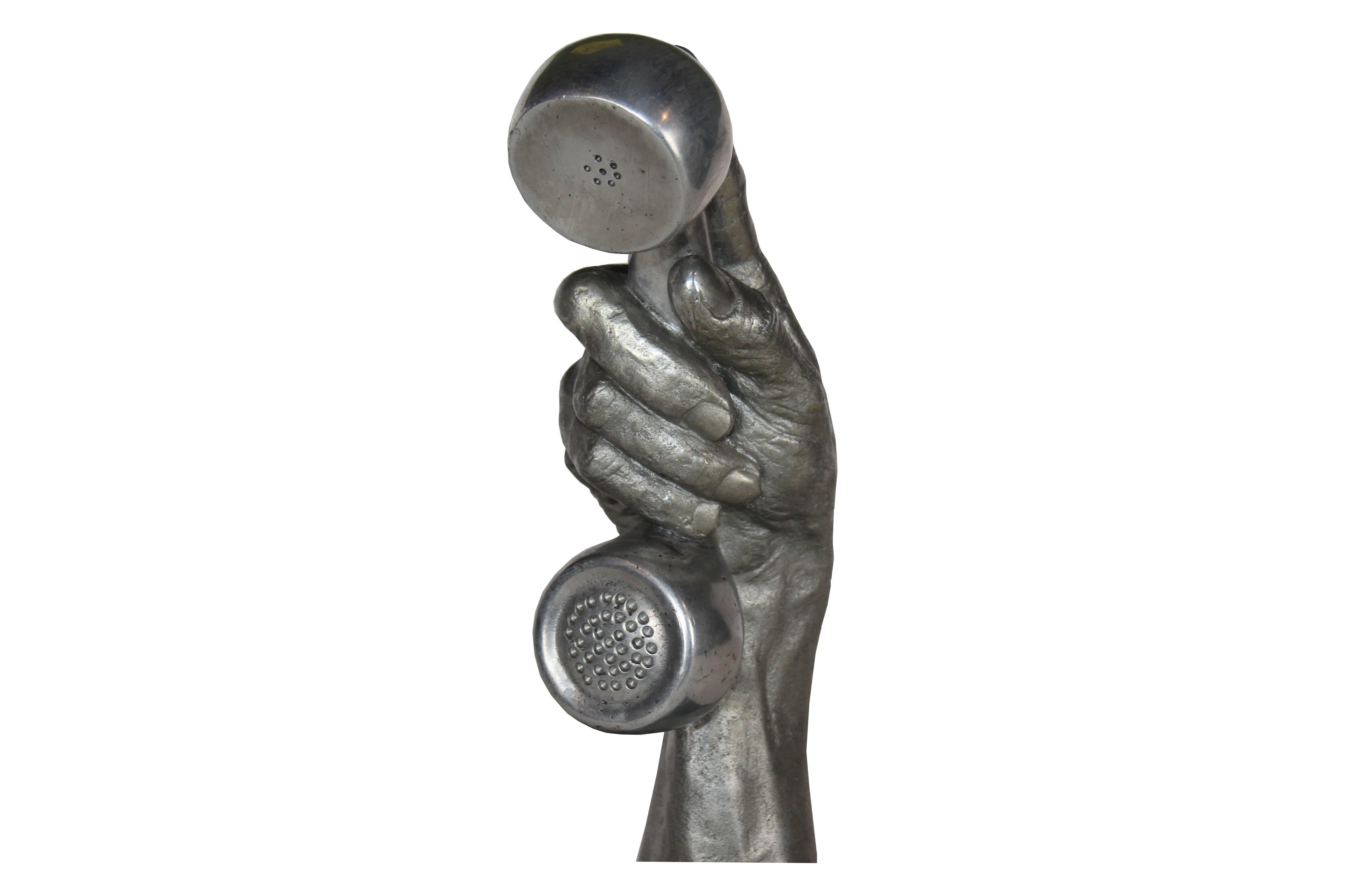 Hand with phone sculpture 