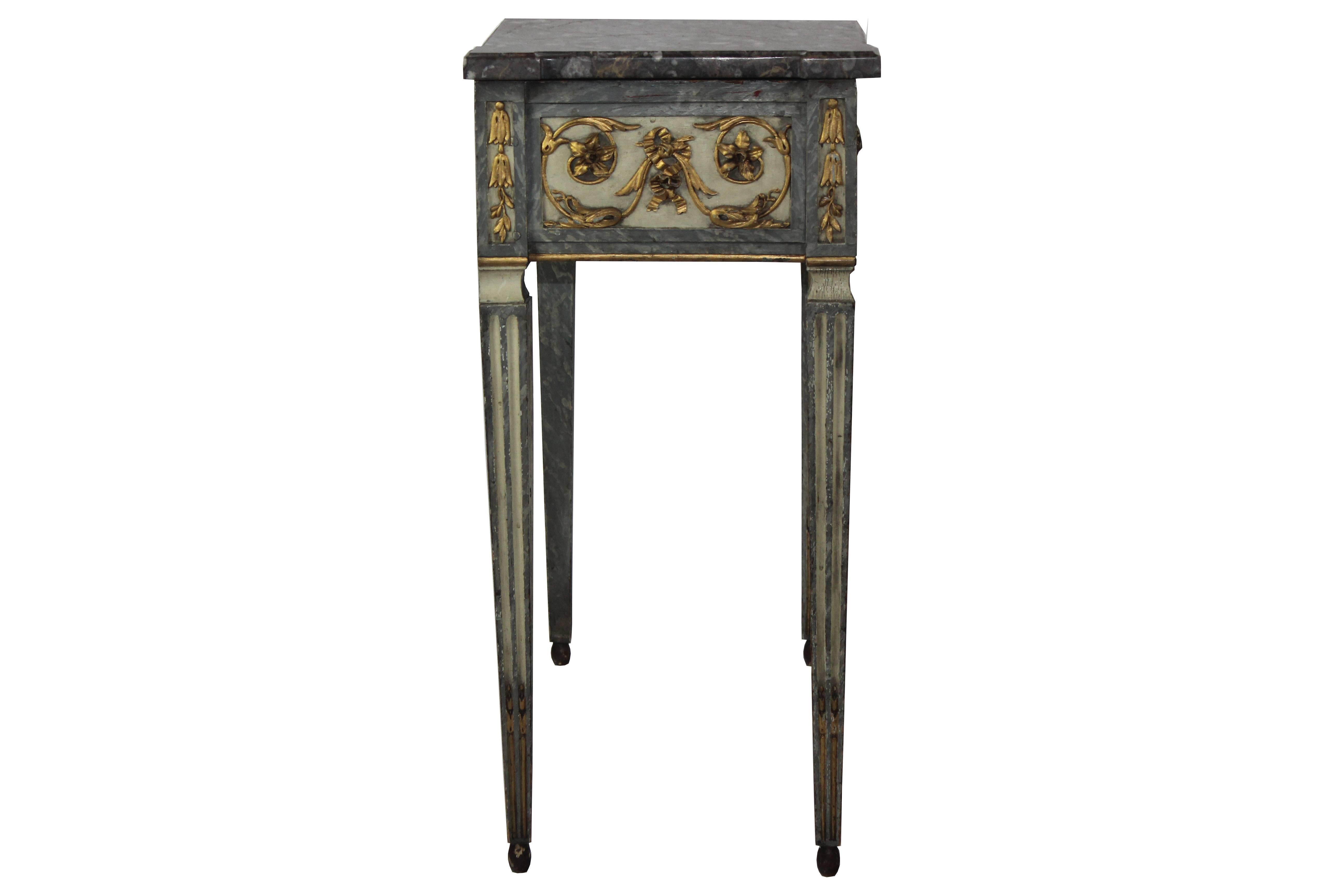 19th century marble-top table painted in faux marble. The drawer handle is wood carved in tigers head ornate carving on the front and on each side.