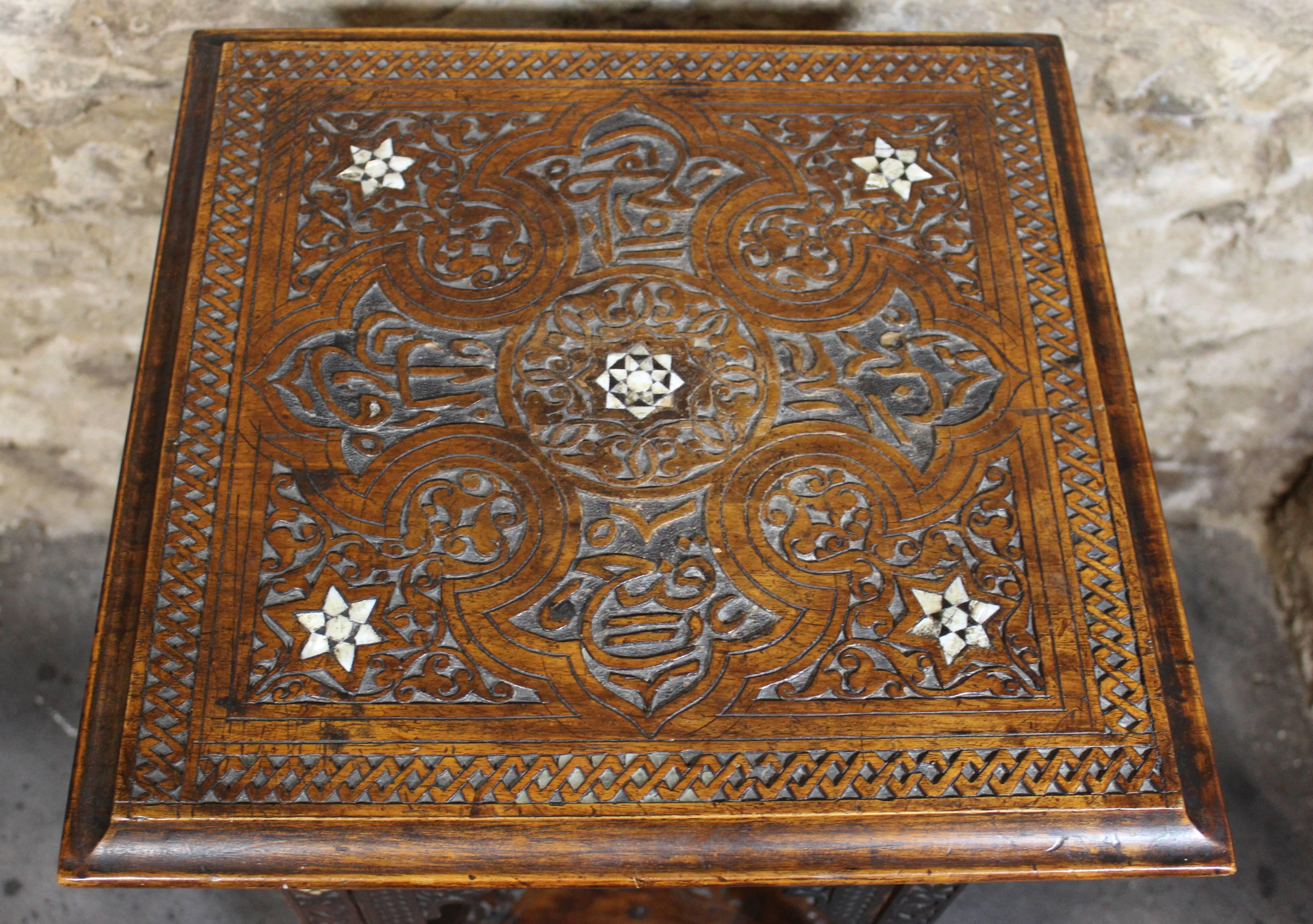 19th century Moorish side table or stand, Middle Eastern.

Hand-carved Syrian style table or stand inlaid with mother-of-pearl.
 