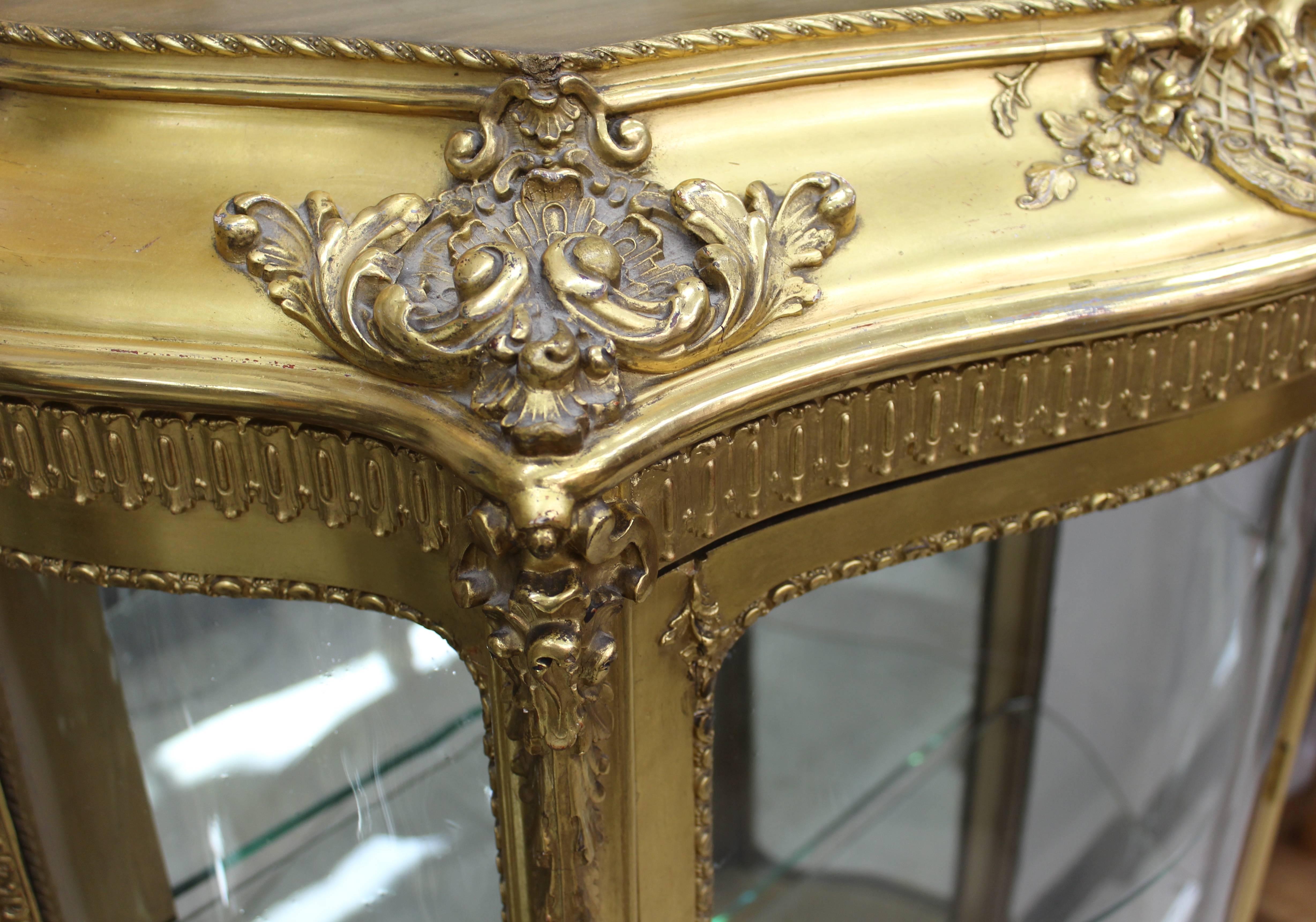 French Louis XV style giltwood vitrine or display case or cabinet.