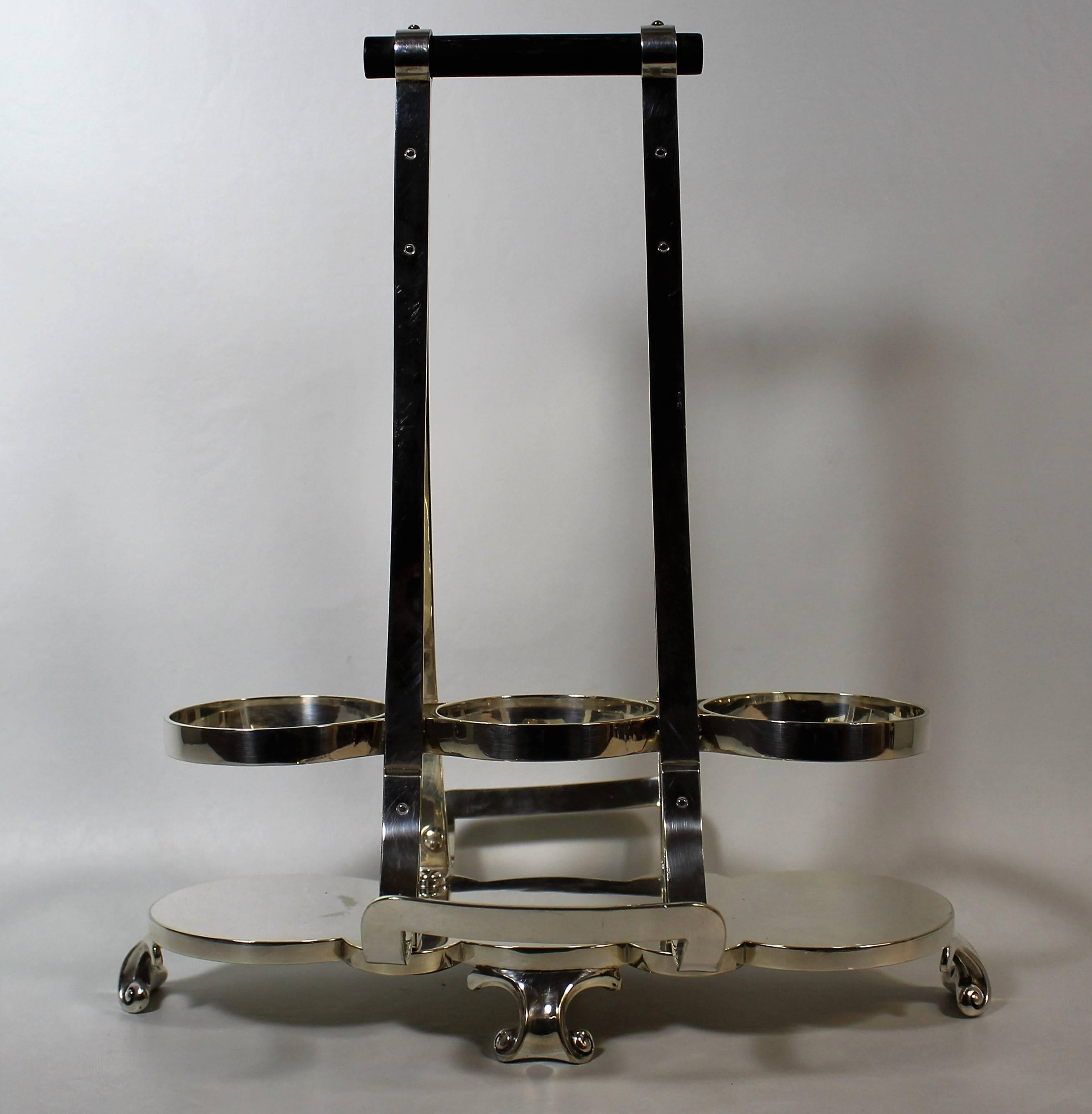 Aesthetic Movement silver plate Tantalus Wine Cradle (1834-1904) made by Hukin & Heath, Birmingham, England and done in the style of Christopher Dresser.